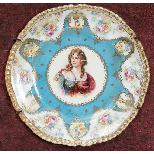 Description: Pair of antique ceremonial plates in polychrome Sèvres porcelain depicting the Sun King, Louis XIV, and...