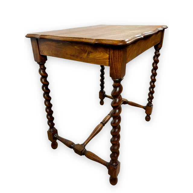 Vintage Oak Barley-Twist Side Table This elegant vintage oak side table featuring a warm, rich wood finish and distinctive...