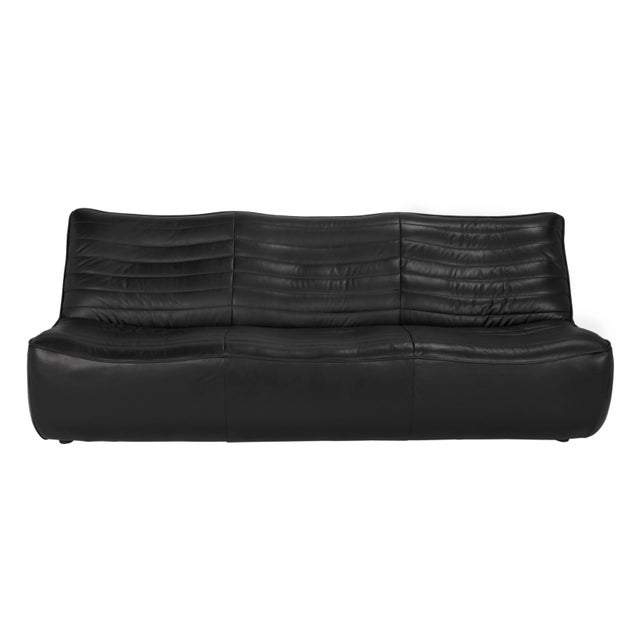 Our New McClain three seater sofa shows off classic mid-century inspired profiles in Onyx Black Top Grain Leather.