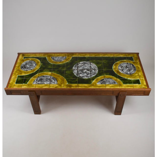 Exceptional and unique coffee table combining solid oak craftsmanship with a striking ceramic top by Jean d’Asti. Created...