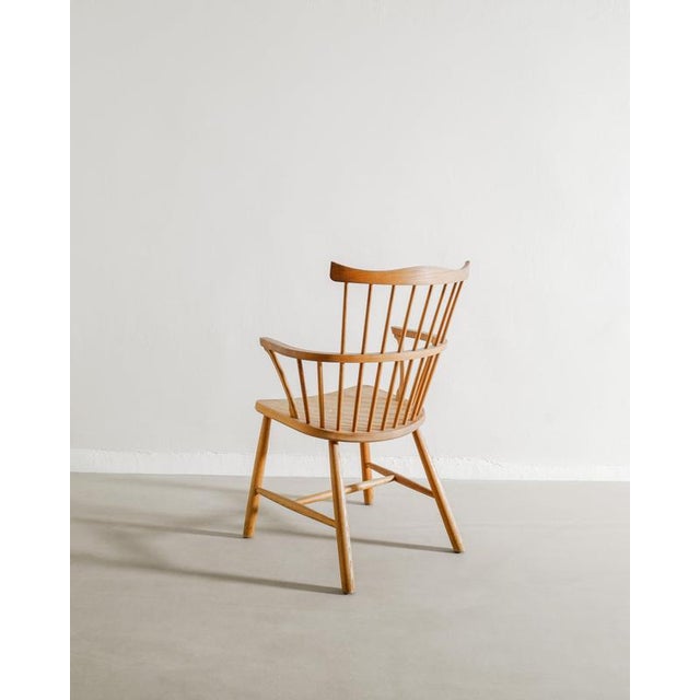 A rare danish mid century modern wooden high back windsor armchair in stained and sculptural oak by børge mogensen...