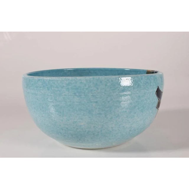 Large artistic bowl made by the danish artist Tue Poulsen (born 1939) in his own studio. The bowl has a base with light...