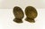 A pair of vintage cast brass seashell shape bookends. Stamped on the bottom with maker's mark and provenance.