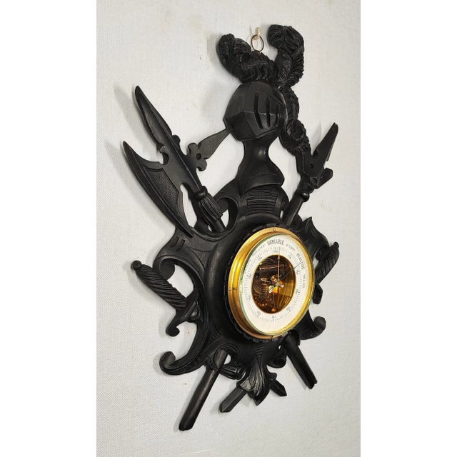This is a highly decorative wall barometer, elaborately crafted in a medieval style. Masterfully carved with the precision...