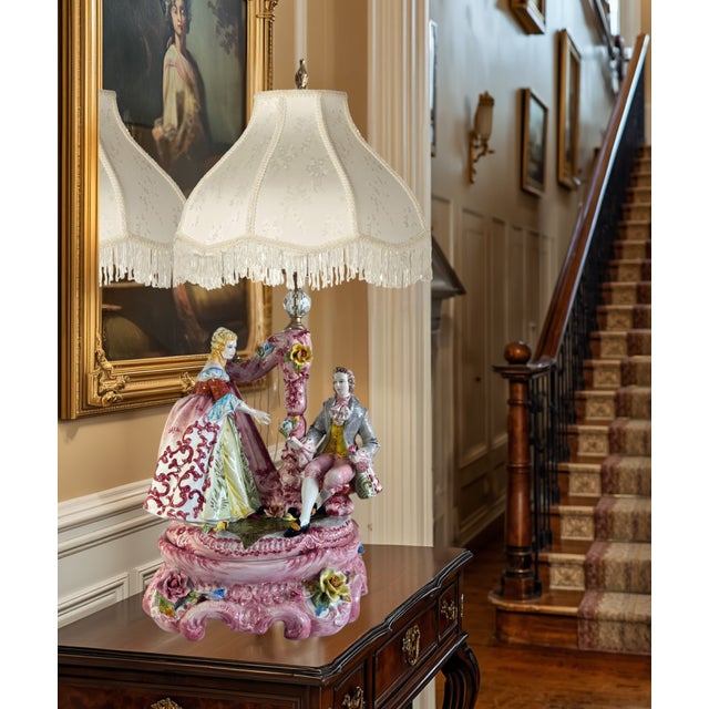 This exquisite mid-century vintage Italian Capodimonte porcelain figural table lamp is a masterpiece sculpted by the...