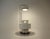 Italian bar set comprising a white bar unit made of plastic, metal, glass and wood, fitted with a lamp. ‍Signs of wear and...