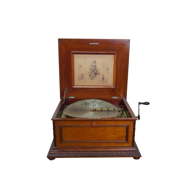 Antique late 19th century Regina music player including additional storage box with approx 46 records and paperwork....