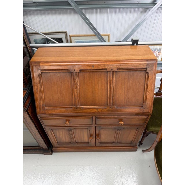 Golden Dawn Secretaire by Lucian Ercolani for Ercol, 1960s, in Good conditions. Designed 1960 to 1969 This piece is...