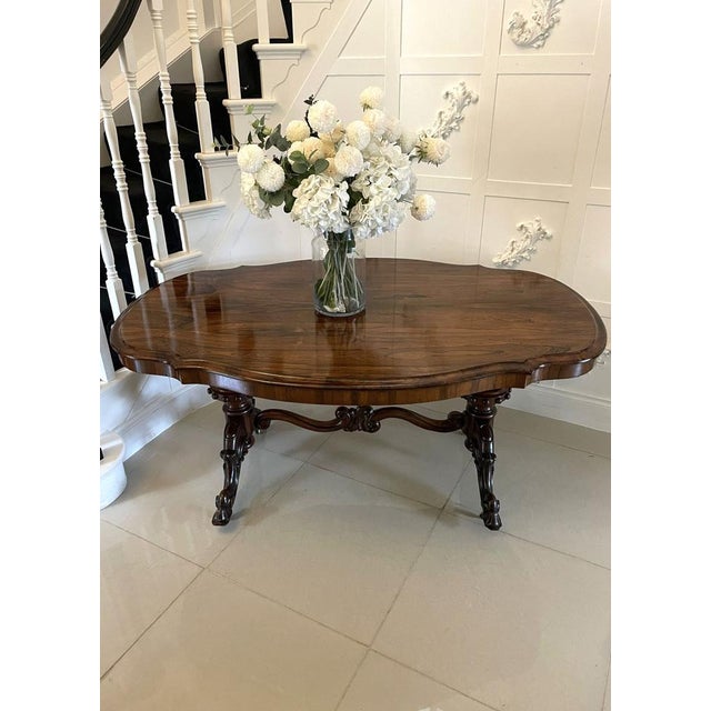 Outstanding quality large antique Victorian rosewood centre/dining table having a magnificent quality serpentine shaped...