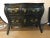 Black distressed bombe commode or nightstand with bronze mounts and pull-out tray top. In this Louis XV style having a...