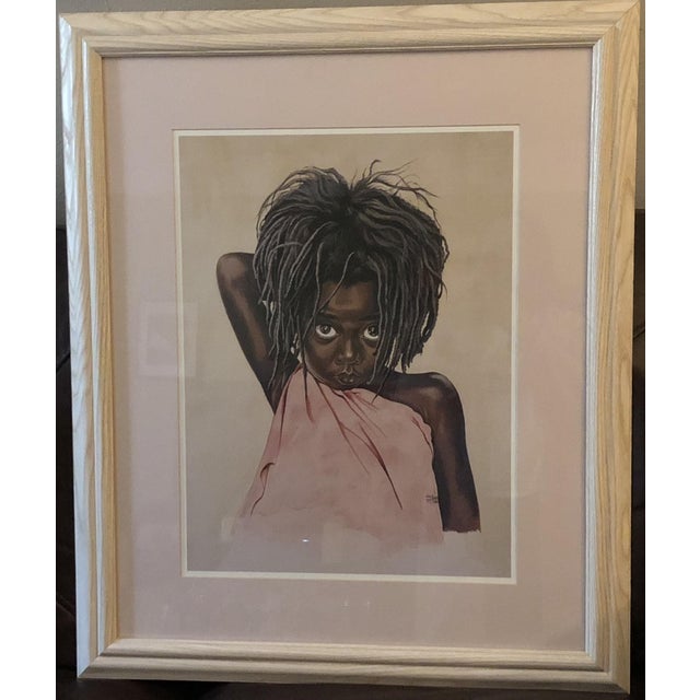 A captivating 1988 large-format framed print by artist Tom Kenealy, capturing a young girl rendered in a deeply...