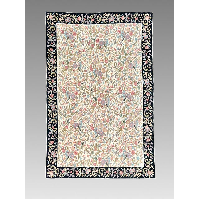 A superb example of Indian Asmara textile art in the form of a 6' x 9' entirely hand stitched pure wool tapestry. A...
