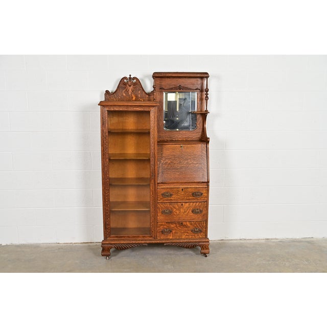 A gorgeous antique Victorian side-by-side drop front secretary desk and bookcase or display cabinet In the manner of R.J....