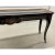 Hard to find lacquered, hand painted chinoiserie two drawer console table with glass insert . The table legs have brass...