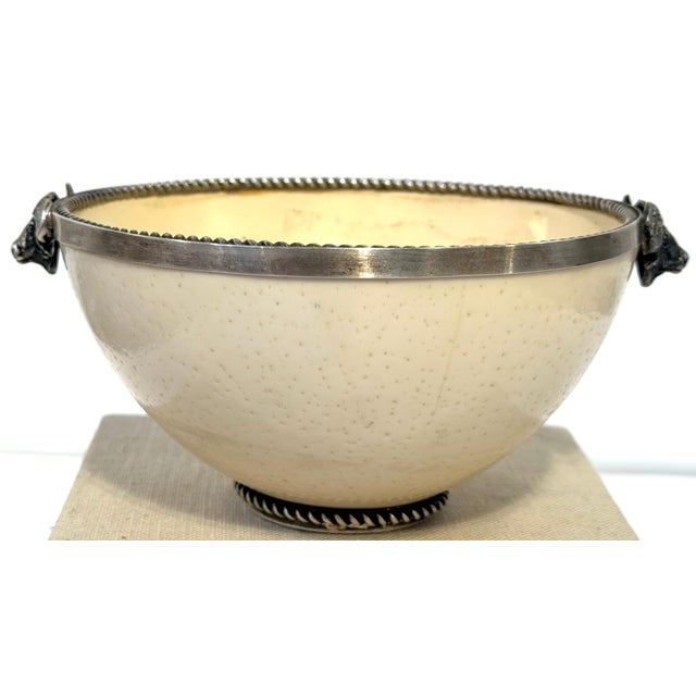 A. Kuger Sterling Silver Mounted Ostrich Egg Bowl with Buffalo Head Handles A sculptural late 20th-century ostrich egg...
