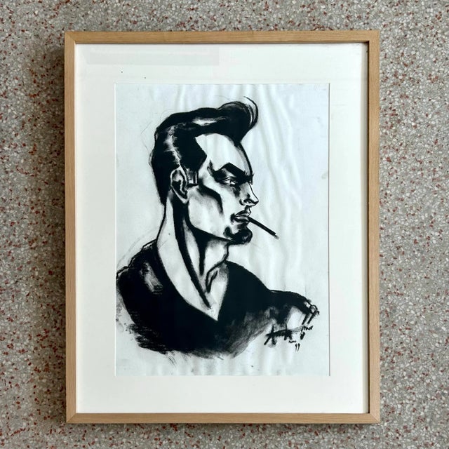 This expressive portrait captures a stylized male figure in bold, angular strokes, his sharp features emphasized by...