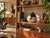 Featuring a rounded teardrop form, textured glaze, and abstract brown, black, and blue accents. A distinctive decorative...