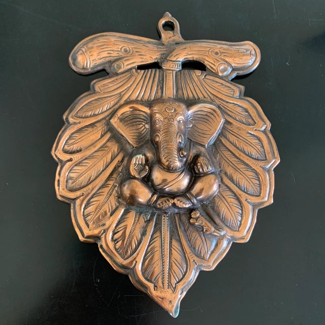 Vintage copper lucky wall decor. Ganesha is a Hindu diety representing wisdom and enlightenment. Also very popular with...