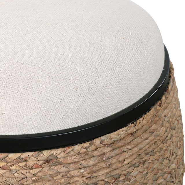 A blend of coastal and organic modern, this round ottoman brings natural texture and understated sophistication to any...