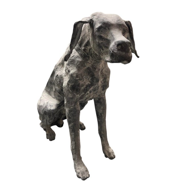This striking life-size garden statue depicts a seated hound, captured in a moment of quiet alertness. Cast in heavy iron,...