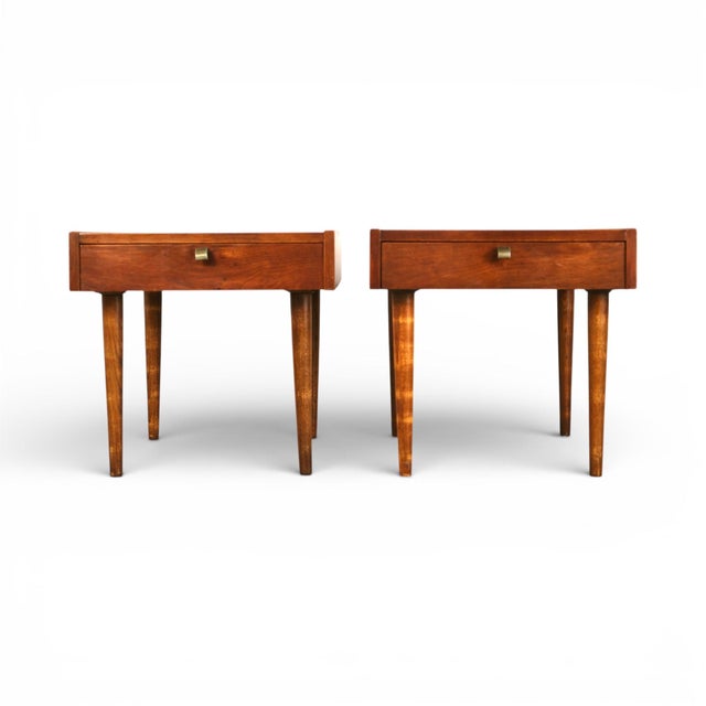 This elegant pair of nightstands, designed by Merton Gershun for American of Martinsville as part of the Dania Collection...