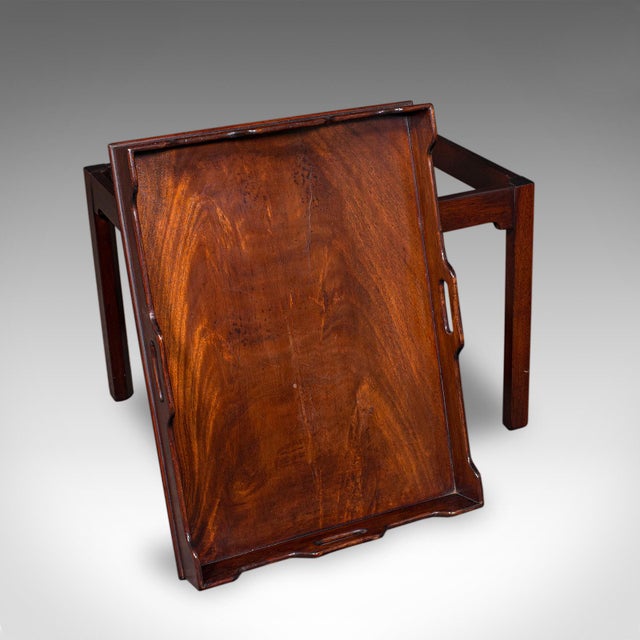 This is an antique silver presentation tray table. An English, flame mahogany serving or side table with Georgian revival...