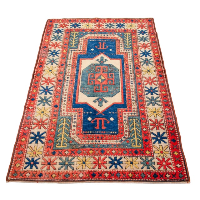 Transform your living space with this captivating 3x5 ft hand-knotted Turkish rug. Boasting a colorful palette and...