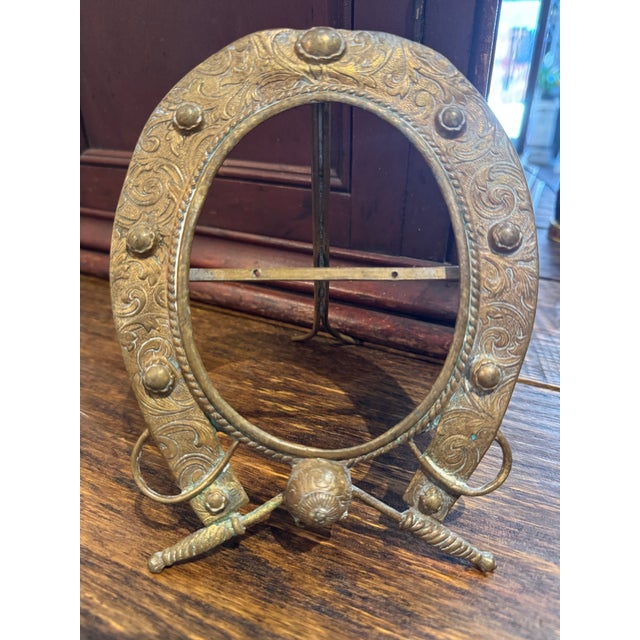 Rare find: Late 19th century equestrian motif brass picture frame. Highly detailed horseshoe sitting atop a riding helmet...