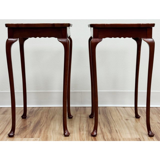Vintage petite mahogany accent tables by Bombay Furniture Co of Canada. Feature a raised scalloped tabletop edge and...