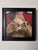 This oil painting on Artefex panel features a figure holding delicate peonies close to their chest, enveloped in a deep...