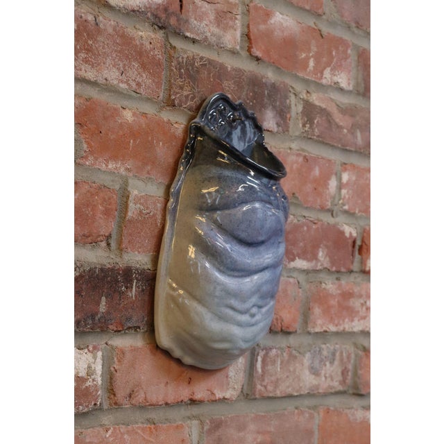 Wall-mounted high gloss blue ceramic letter/recipe holder by ceramicist, Deanna Nichols (b. 1942-2017, Missouri). Holding...