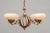 Chandelier in Art Deco style, made (probably in France) in 1930s/40s. Ivory opal glass shades on forged iron body with...