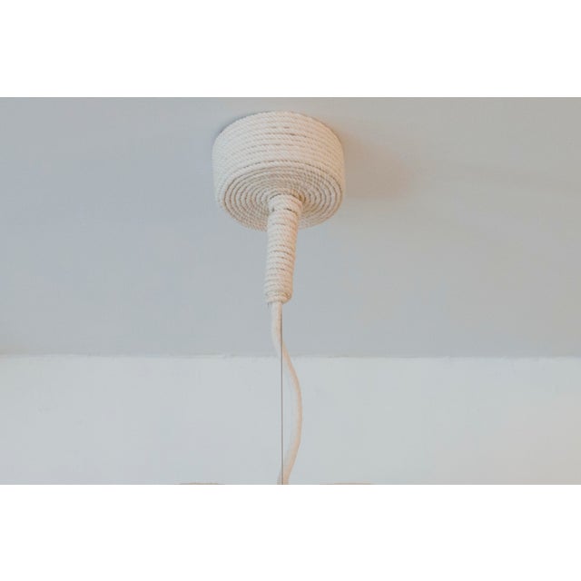 This is a hand made hanging light fixture. It’s made of natural white cotton rope. The drop of thr cotton globe can be a...