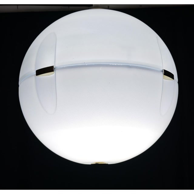 Space Age design pendant lamp, produced between the 1960s and 1970s. Made of plastic, it features an original pulley with...