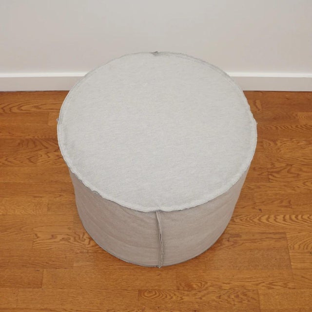 The Maxim small round pouf, shown here, is perfect for living or family rooms. The foam down wrap construction and tight...
