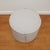 The Maxim small round pouf, shown here, is perfect for living or family rooms. The foam down wrap construction and tight...