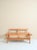 Two-seater sofa by Yngve Ekström for Swedese, with pine structure and original orange and pink striped cushions. This...