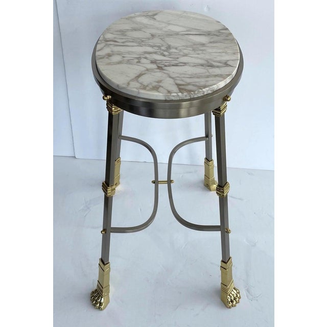 Mid-Century Maison Jansen Side Table Oval Empire Revival Polished Steel, Brass, and Marble from a Palm Beach estate. This...