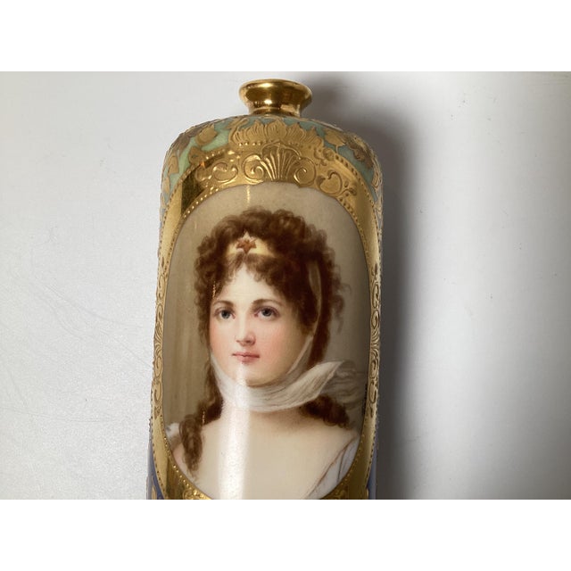 A diminutive and expertly painted cabinet vase with hand painted portrait of Queen Louise, signed Wagner. The iridescent...