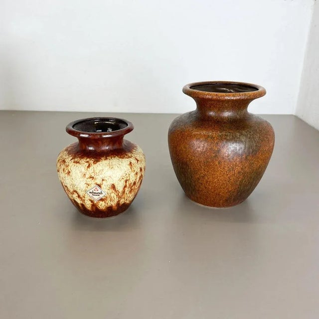 Set of two fat lava art vases Producer: Scheurich, Germany Decade: 1970s These original vintage vases was produced in the...