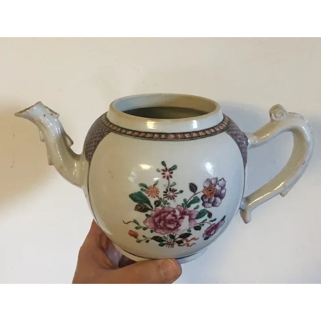 Antique 18th c. Chinese export porcelain tea pot in bright famille rose glaze. Decorated with floral sprig bouquet within...
