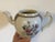 Antique 18th c. Chinese export porcelain tea pot in bright famille rose glaze. Decorated with floral sprig bouquet within...