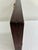 A compact vintage Chinese suanpan abacus crafted from dark reddish-brown wood with 11 rods and traditional wooden counting...