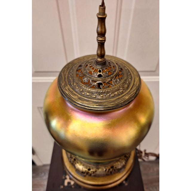 Beautiful art nouveau steuben gold aurene vase table lamp with great brass and wood base is in great antique condition. It...