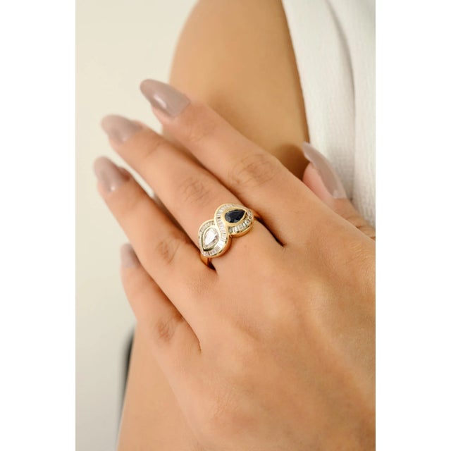 Elevate your fine jewelry collection with this exquisite 14k Yellow Gold Sapphire and Diamond Ring, a timeless statement...