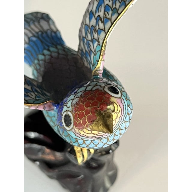 This vibrant cloisonné bird figurine features dazzling hand-painted enamel in a stunning palette of blue, turquoise, and...