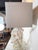 This unique table lamp by Regina Andrew features a sculptural faux white coral body, adding a coastal or organic touch to...