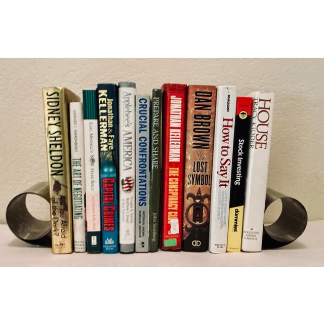 Add a sleek high-tech minimalistic edge to your library with this original pair of 1970s “Bookworm” spring loaded coil...