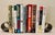 Add a sleek high-tech minimalistic edge to your library with this original pair of 1970s “Bookworm” spring loaded coil...