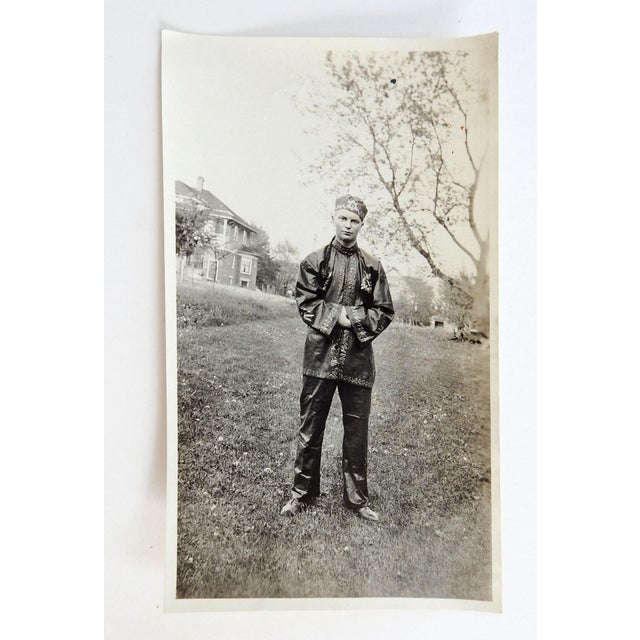 Early 20th century snapshot photograph of a handsome man in costume. Unframed.